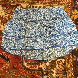 Blue and purple floral skirts.